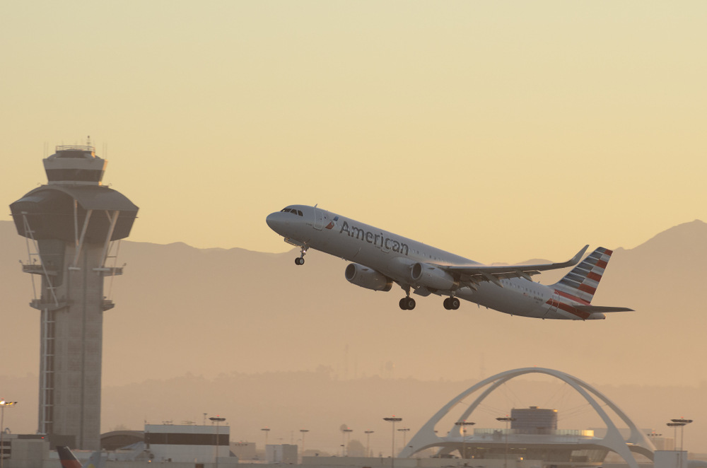 An American jet takes off from LAX