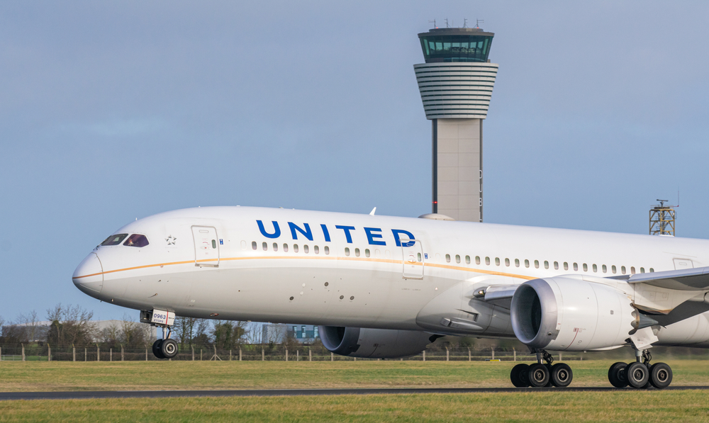 A large United jet taxis on the runway 
